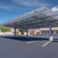 double cantilever commercial solar carport structure under view in church paring lot