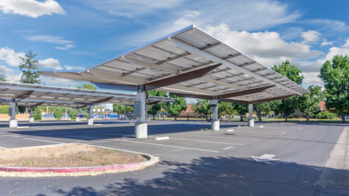 side view of inverted cantilever commercial solar panel canopy San Joaquin High School